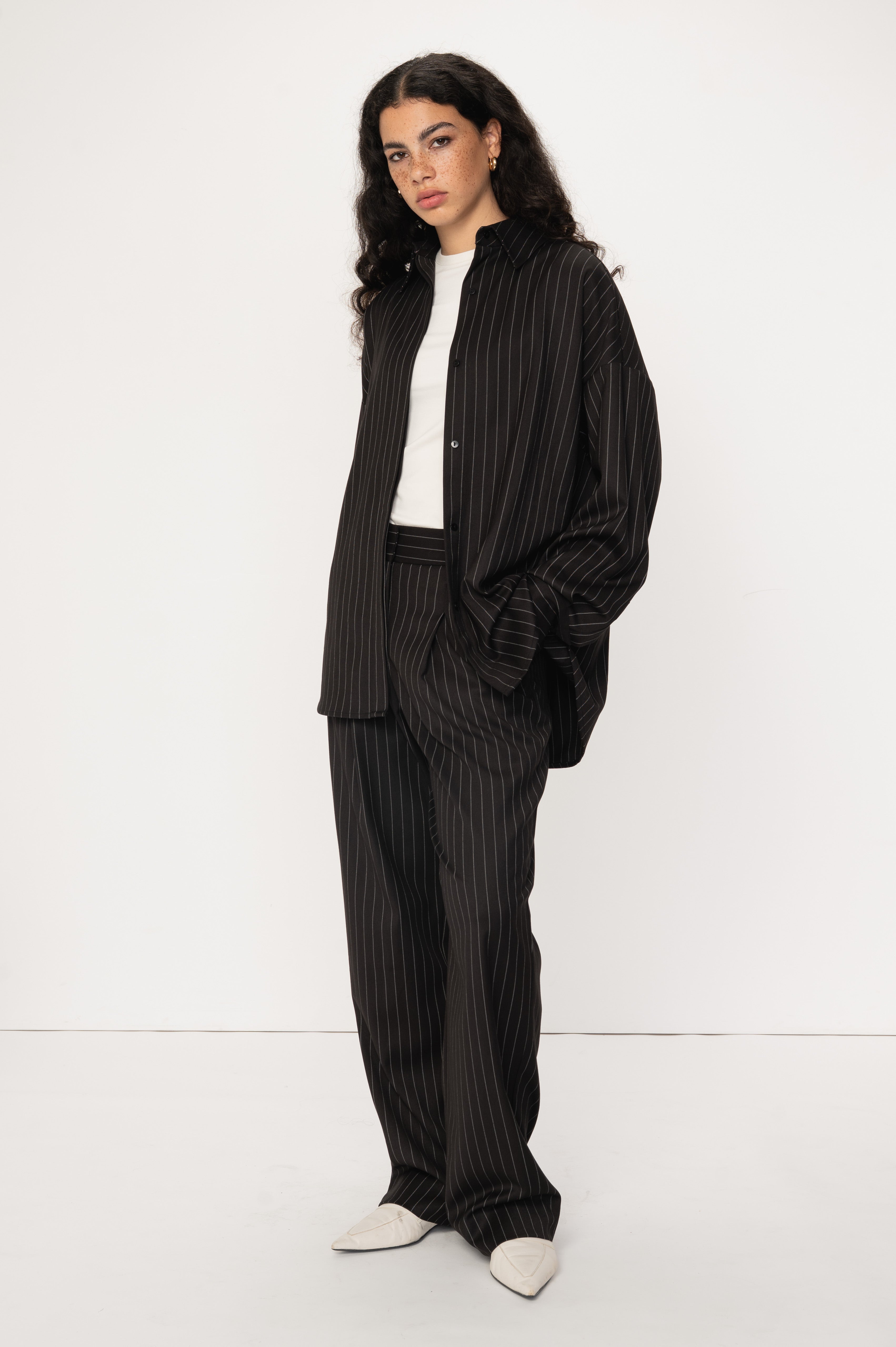 VIVEH Thuban top in Black Pinstripe – styled view