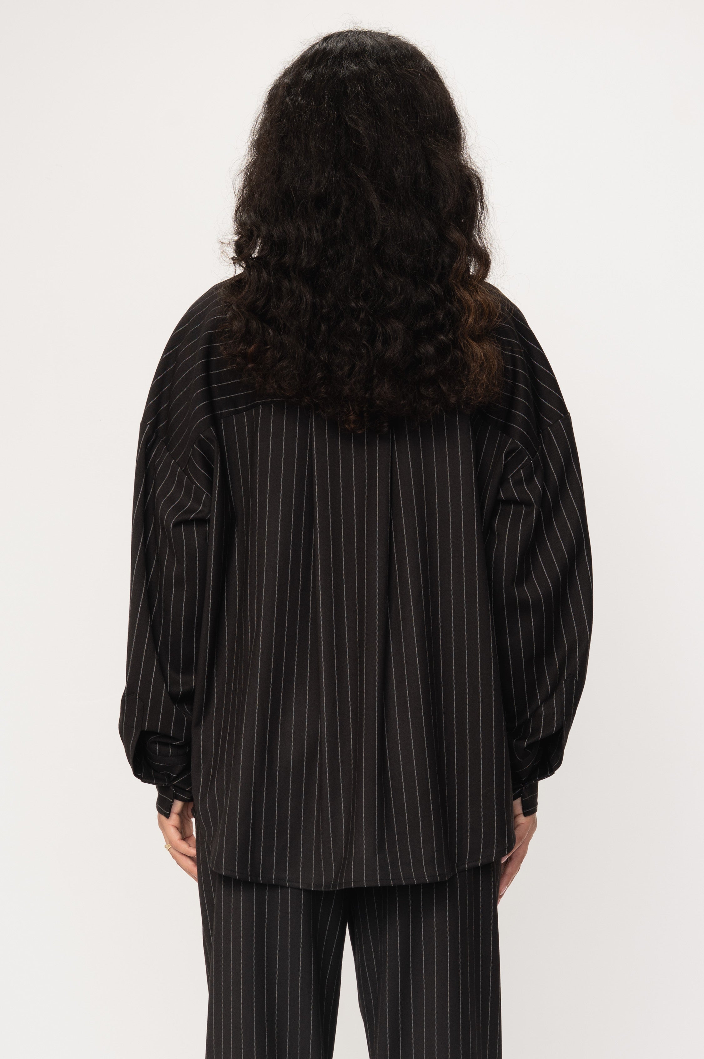 VIVEH Thuban top in Black Pinstripe – styled view